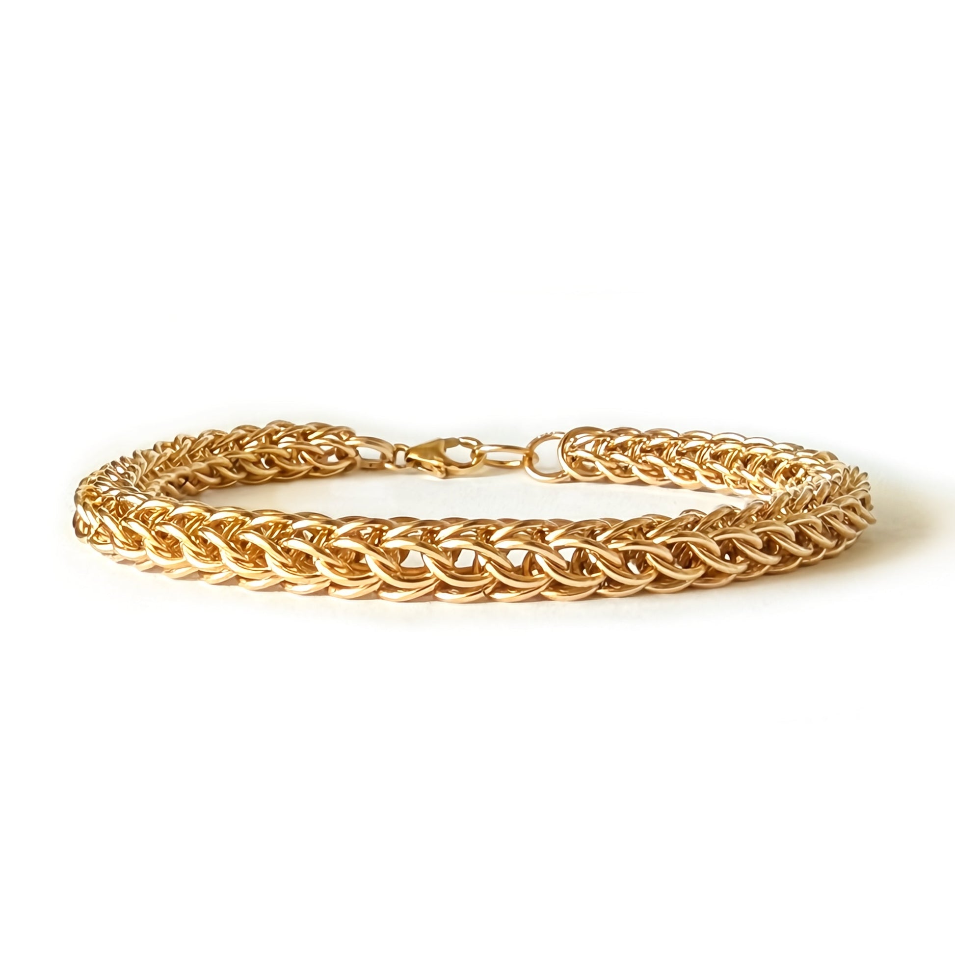 Gold bracelet on a white background
