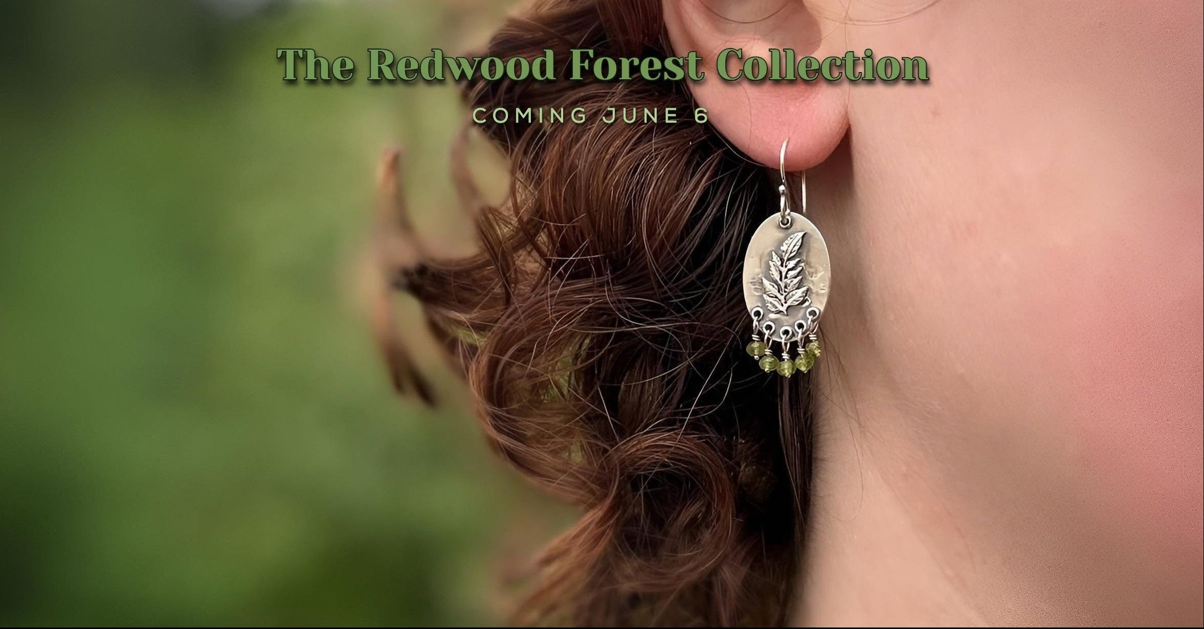 Close-up of a person wearing earrings with a blurred natural background, featuring 'The Redwood Forest Collection' text.