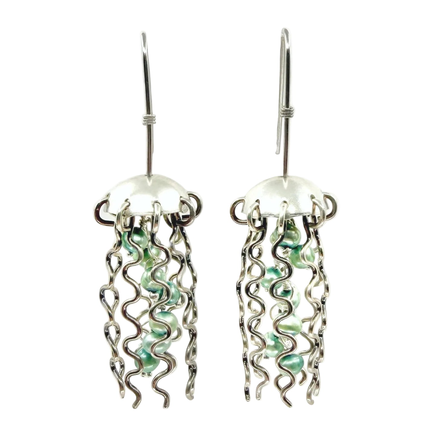 Pair of silver jellyfish earrings with green pearl centers on a white background