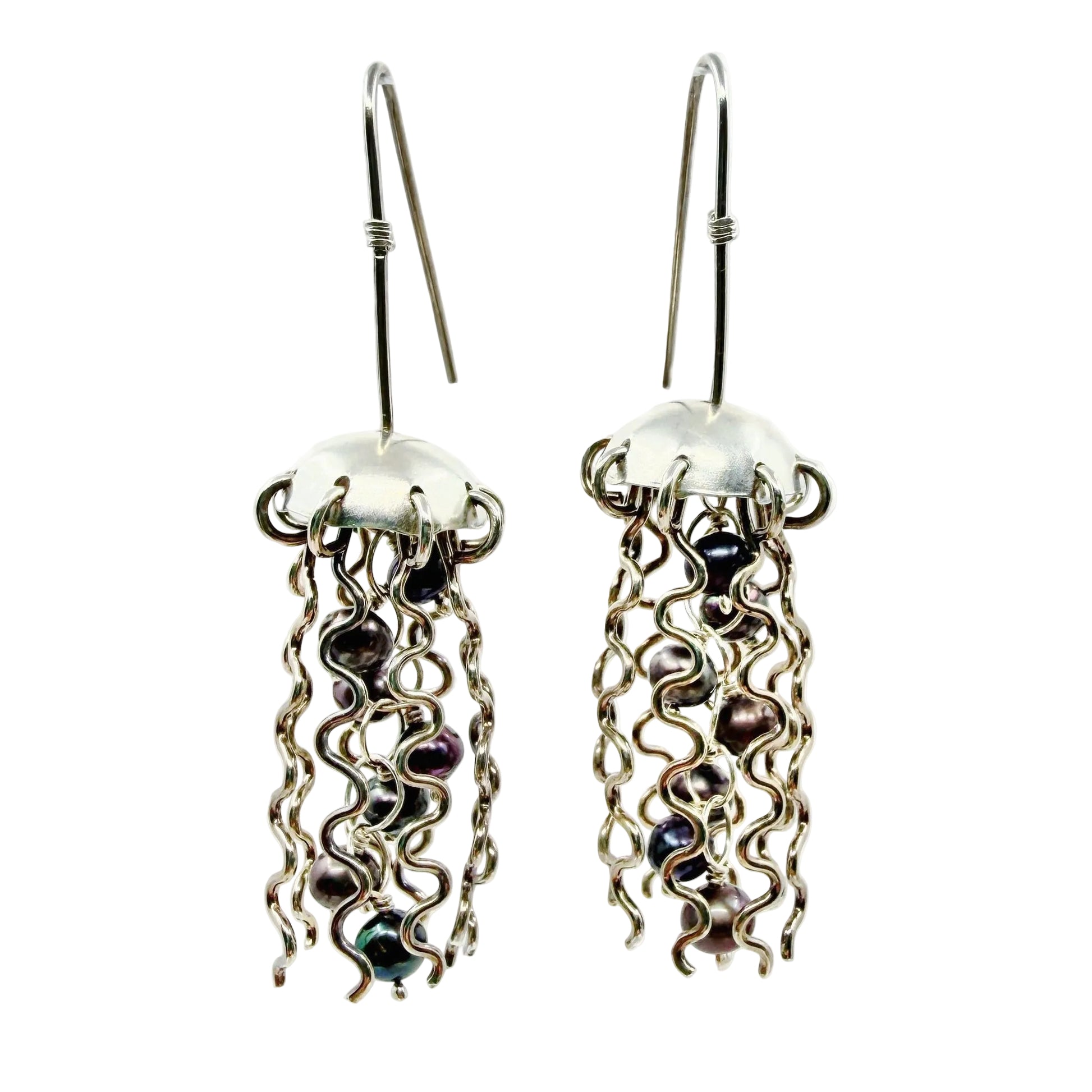 silver jellyfish earrings with dark pearl centers on a white background